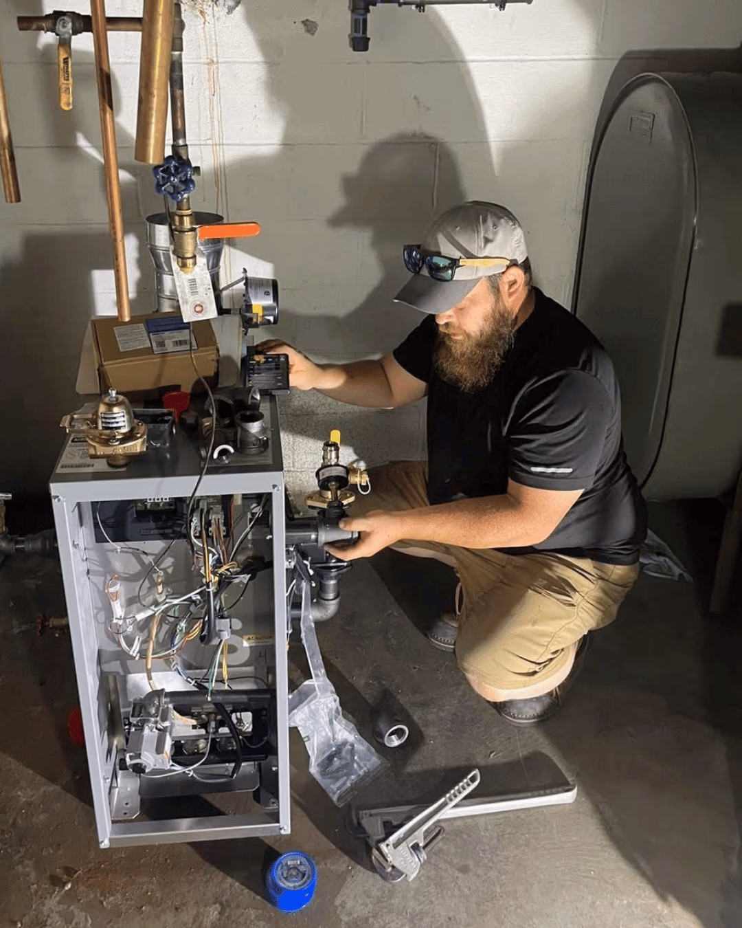 Yorktowne technician servicing equipment in a home utility room