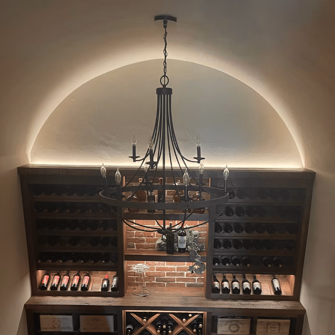 Chandelier and shelf lighting in a finished home interior