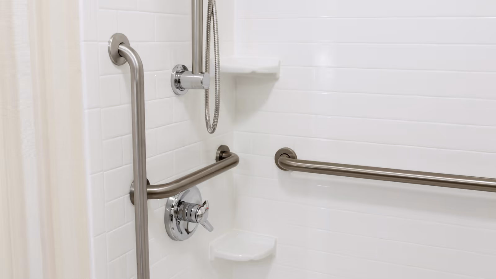 Grab bars installed in a walk-in shower