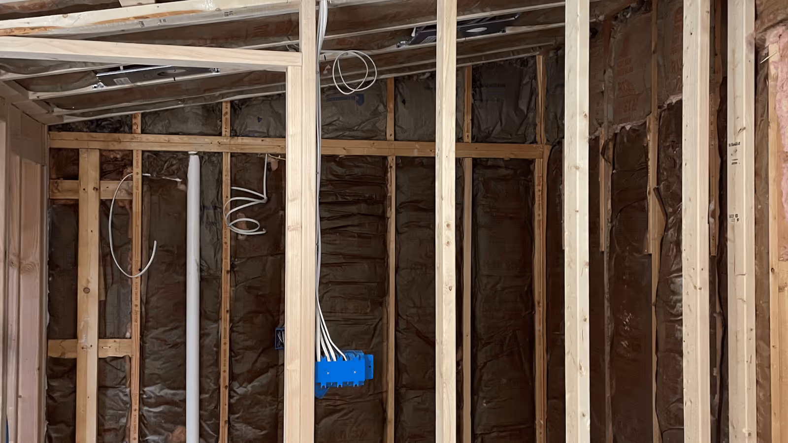 Framed and wired wall ready for drywall