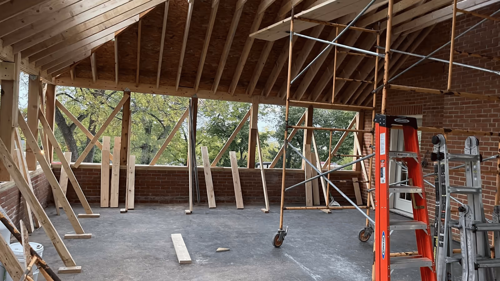 Framing and repair work underway on a covered porch